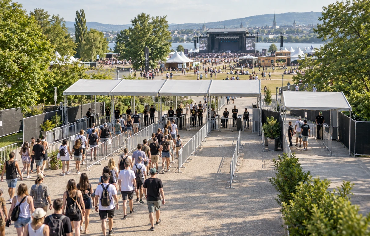 Multi-entrance outdoor festival with separate admission lanes and pedestrian barriers